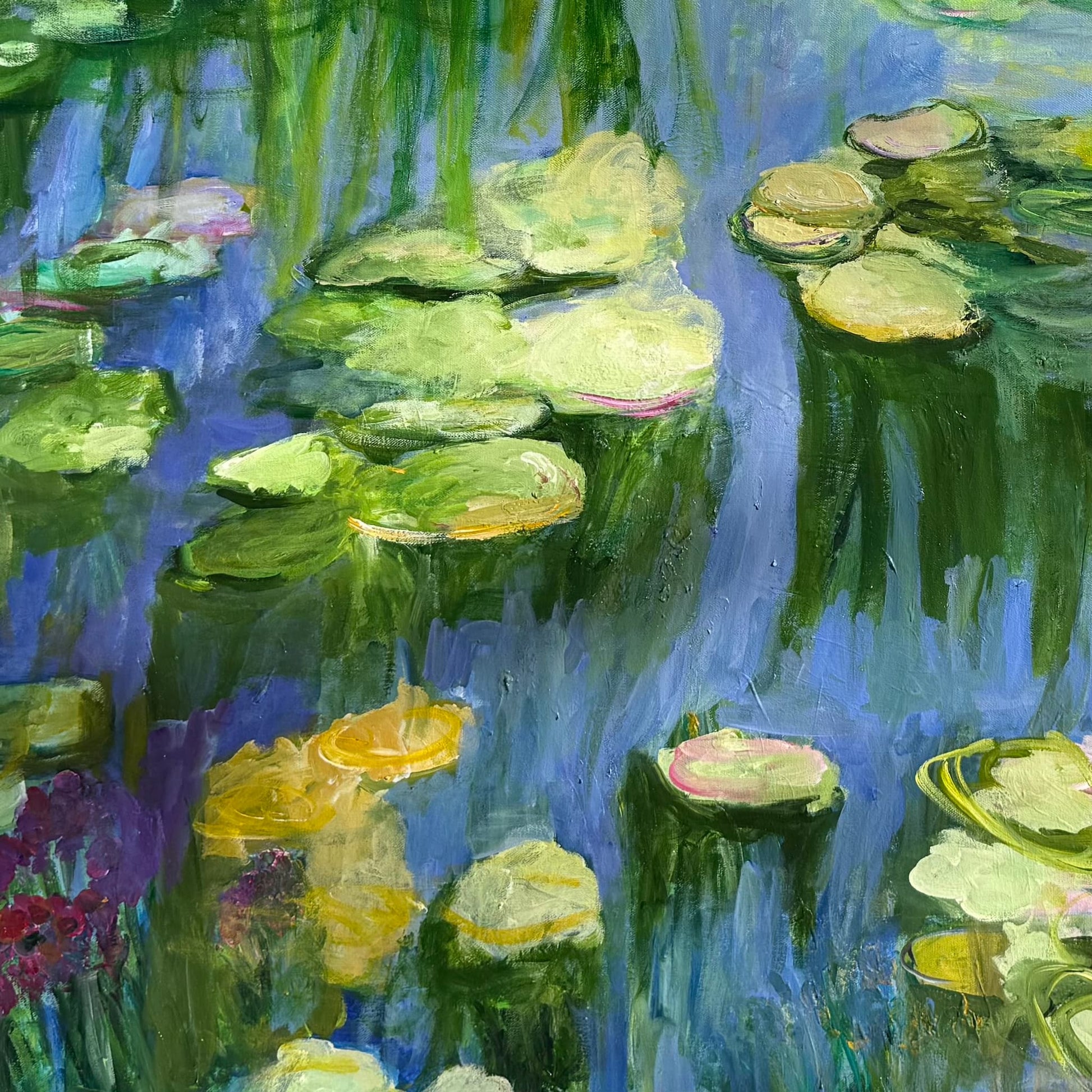 Detail of "Water Lily Pond" by Maria-Victoria Checa showing expressive brushwork — golden and green lily pads floating on a periwinkle blue pond with pink blooms and crimson wildflowers at the water's edge — original acrylic painting by Checa Art