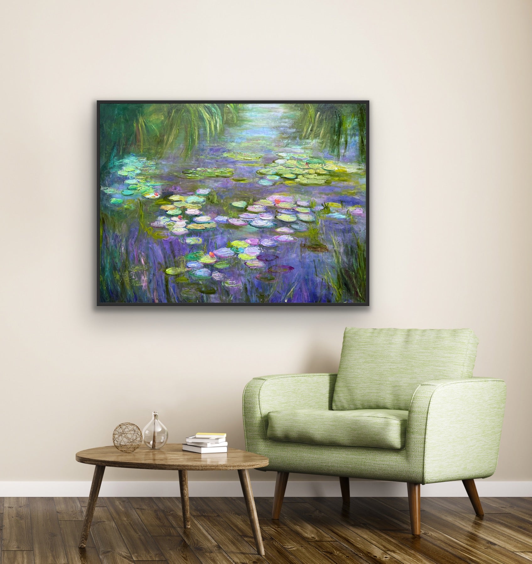 Framed painting of water lilies on a wall above a green armchair and wooden coffee table.