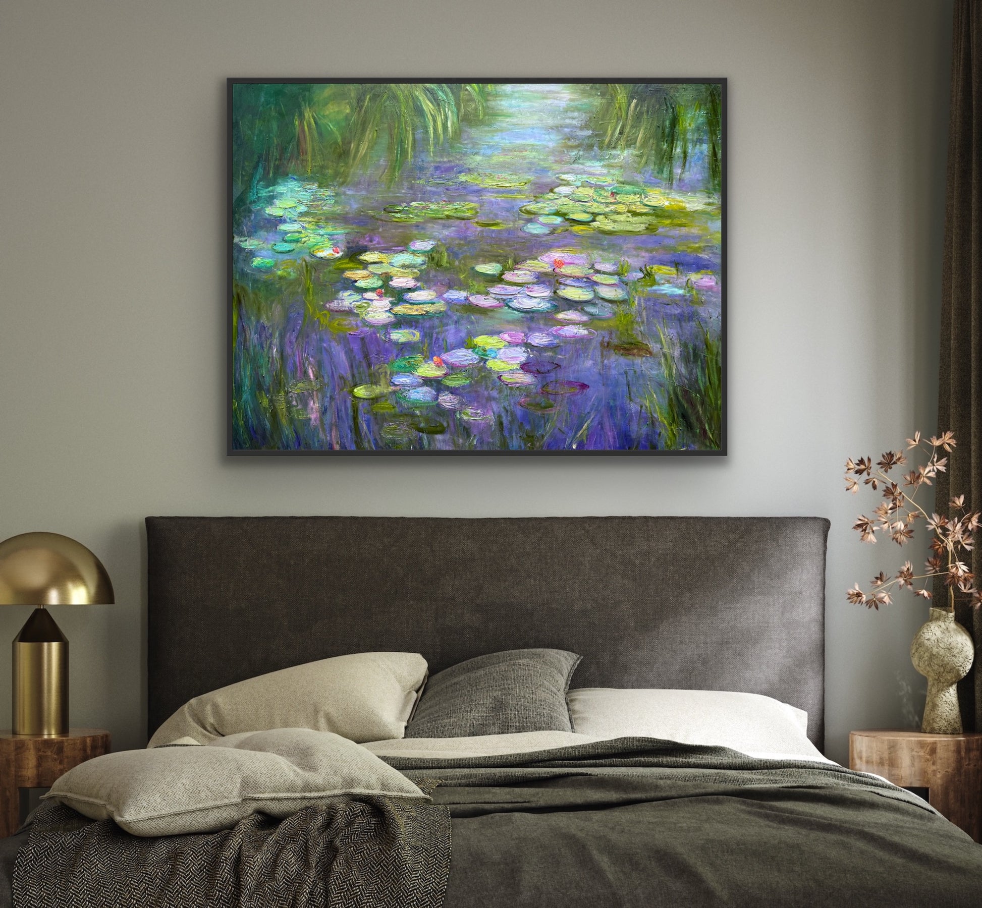 Bedroom with a large painting of water lilies on the wall above a bed.