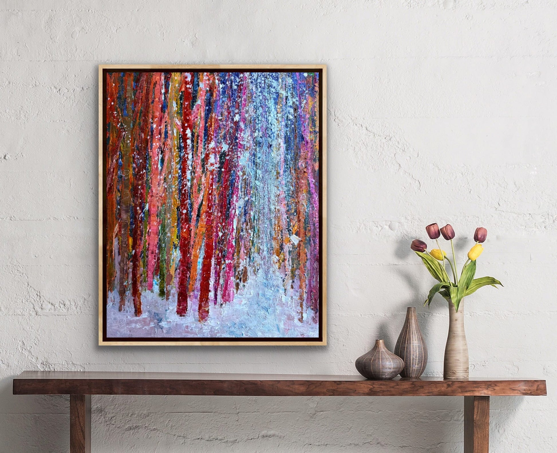 Winter Land Path original oil painting by Checa Art framed and displayed above a wooden console table with tulips