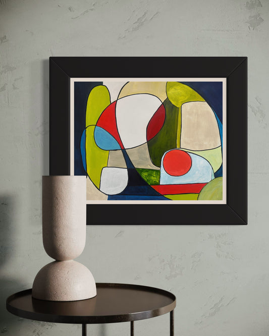 Framed abstract painting ‘You and Me’ by Maria-Victoria Checa displayed on a textured wall above a dark round table with a sculptural beige vase.