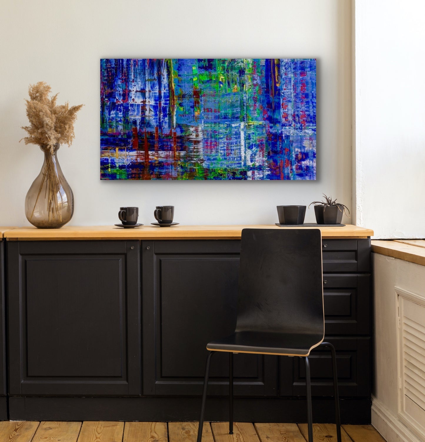 modern abstract painting in tones of blue, 24" x 48" shown in a room 